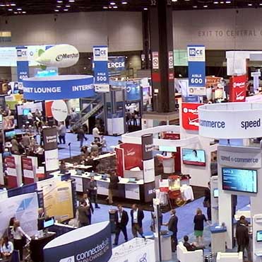 Photo of an Event's Exhibition Hall with Booths and Attendees.  Event security is a specialty of Maloney Security.